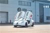 Delta Motorsport range extended electric vehicle with open doors